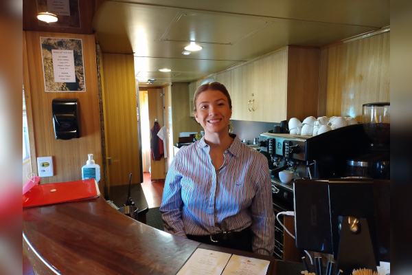 A smiling barista